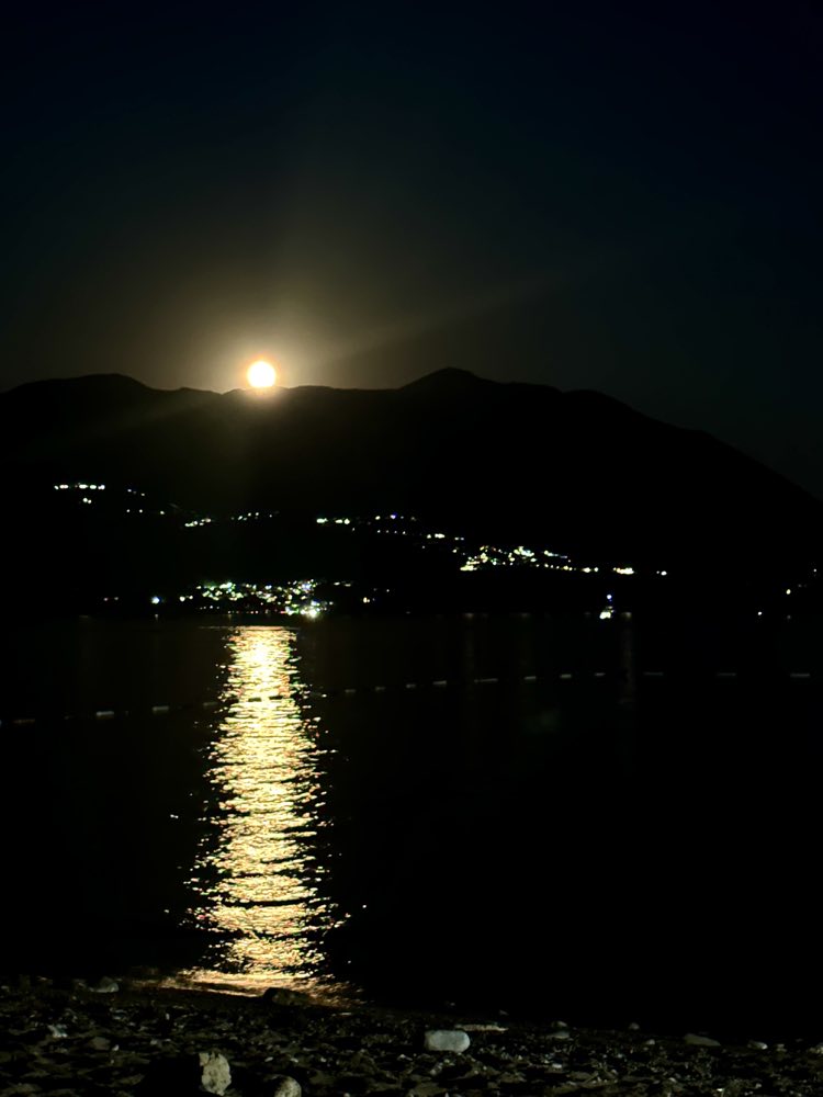 Moonrise over the still water of the Bay of Kotor