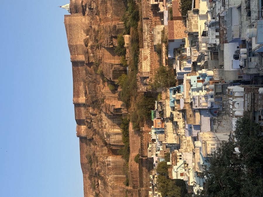 The Blue City beneath Mehrangarh Fort at golden hour