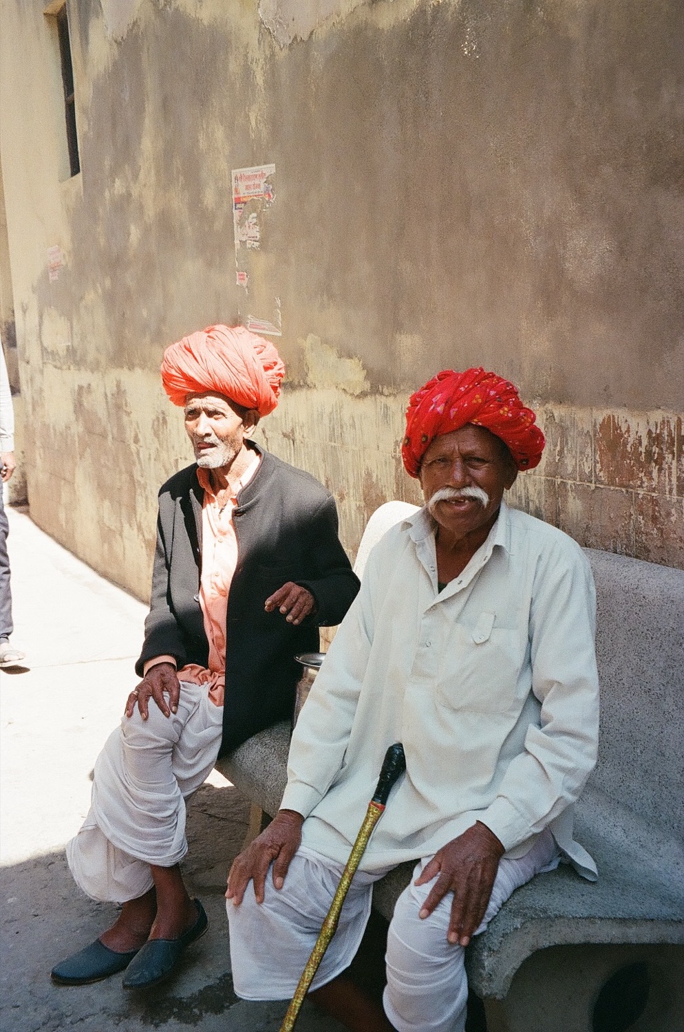 Two elders in red turbans
