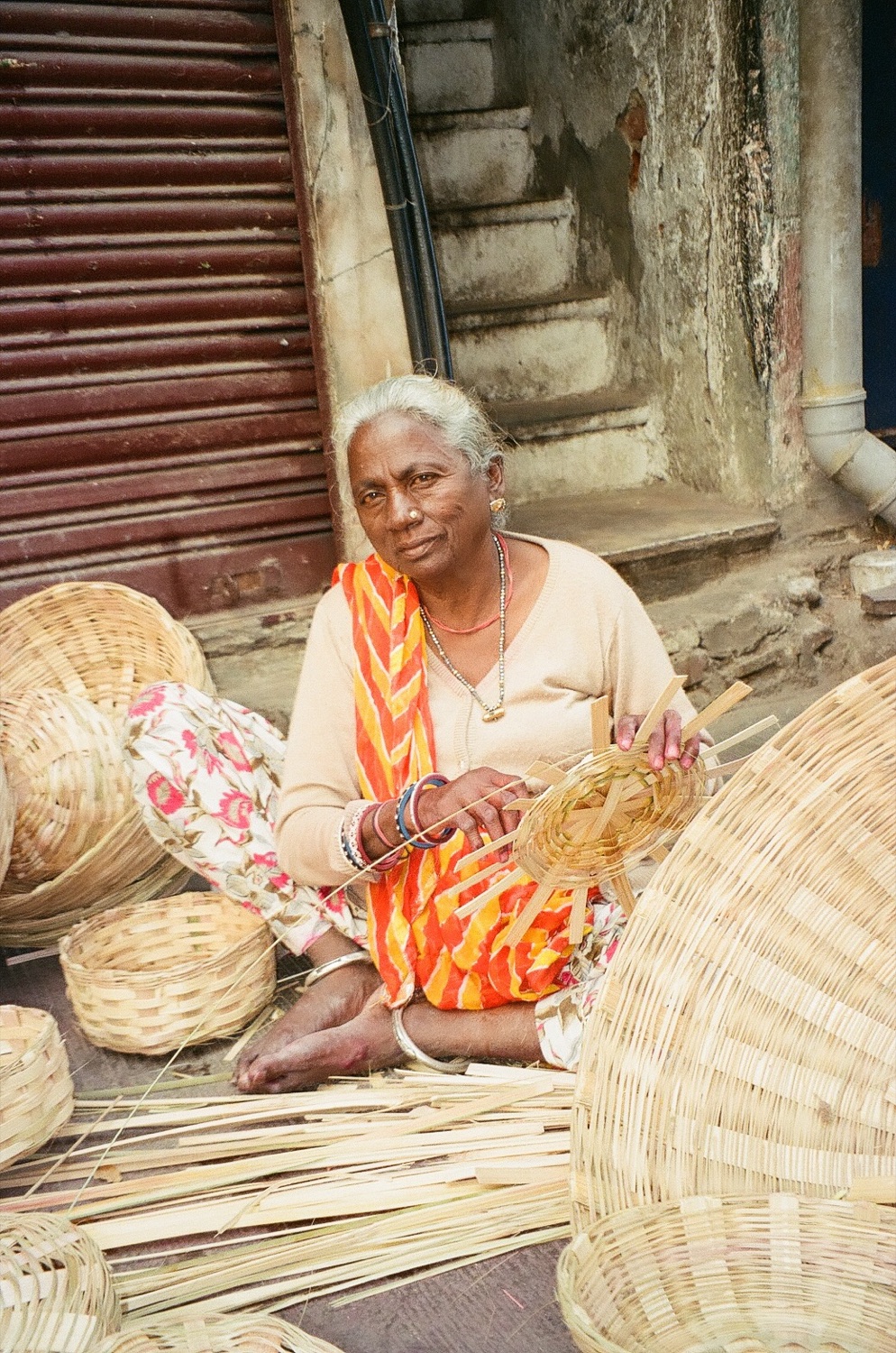 A woman weaving baskets